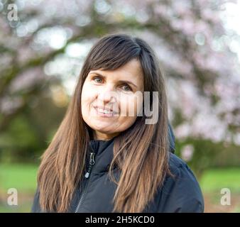 Portrait of a mature woman outdoors, Stanley Park; Vancouver, British Columbia, Canada Stock Photo