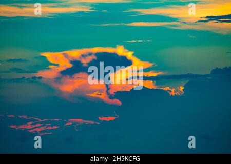 Sunset cloud formation at dusk over the Solomon Sea off Morobe Province, Papua New Guinea; Morobe Province, Papua New Guinea Stock Photo