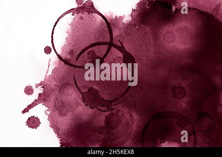 Red wine color background with spots of circles of wine glasses. Abstract watercolor background. Hand painted. Burgundy color. Stock Photo