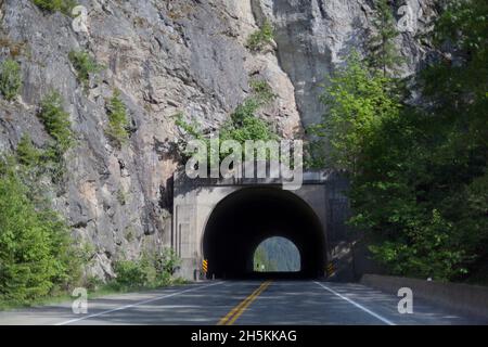 Tunnel on a two lane highway through a mountain in the Coast Mountains in Interior British Columbia; British Columbia, Canada Stock Photo