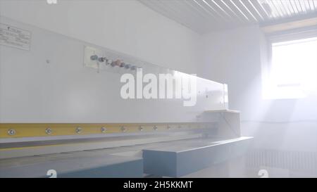 Modern equipment for woodworking in shop. Action. Closed belt machines for cutting or grinding wooden boards. Woodworking equipment of modern automate Stock Photo