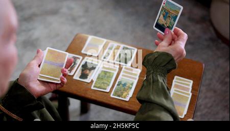 A woman is using tarot cards Stock Photo