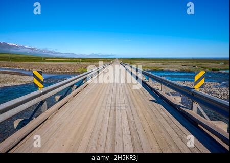 Single lane wooden bridge over river, Road Hlidarvegur in Northern Iceland; Ketilsstadhir, Austurland, Iceland