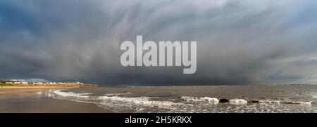 Dramatic storm clouds over the Atlantic Ocean and coastline at Whitburn; Whitburn, Tyne and Wear, England Stock Photo