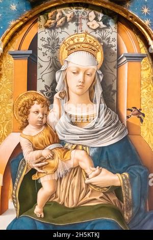 Detail of medieval religious painting showing Virgin Mary as a queen sitting on a throne with Jesus as a boy on her lap Stock Photo