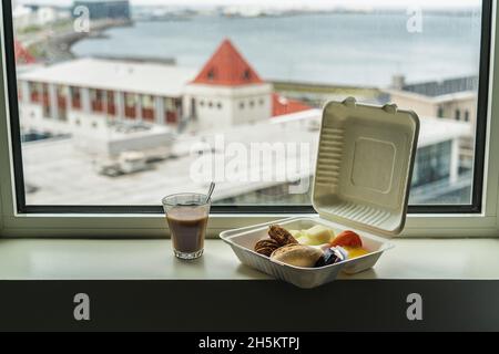 Takeaway in recyclable eco-friendly packaging with latte. Breakfast with fantastic views Stock Photo