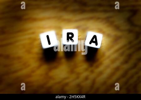 IRA spelled out with dice for retirement planning and savings investments Stock Photo