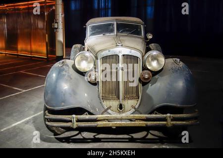 Rusty and dusty 1937 Horch Typ 853, German classic car / oldtimer, in bad shape ready to be restored in garage Stock Photo