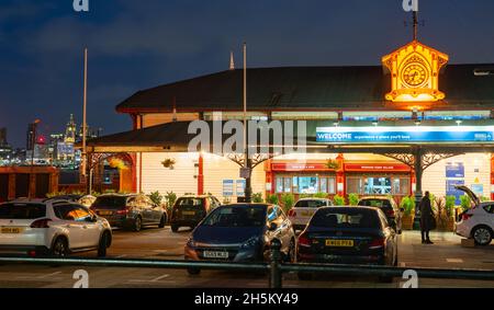 Woodside Ferry Village, Birkenhead, still the actual Ferry terminal as well as a modern food outlet, with the Liverpool skyline in the distance. Stock Photo