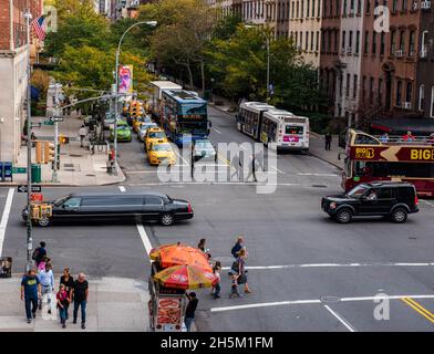 New York, NY, USA -- Oct 13, 2015. Photo looking over 10th Street in Manhattan where a stretch limo is headed uptown. Stock Photo