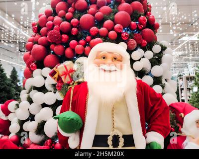 the mall sells toys from Santa Claus, which stands under the Christmas tree Stock Photo