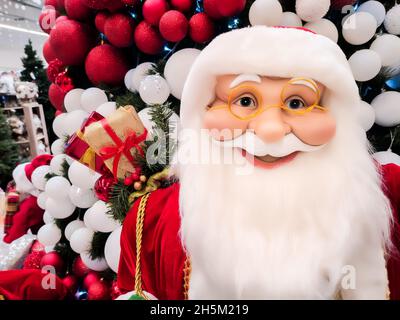 the mall sells toys from Santa Claus, which stands under the Christmas tree Stock Photo