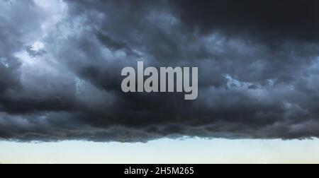 Dark cloud with a clear edge of the storm cloud, in front of a thundery front, weather changes. Stock Photo