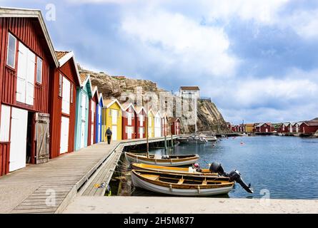 Smögen, Sweden - June 9, 2021: A bay with colorful fishing cottages on island Smogen at Swedish west coast Stock Photo