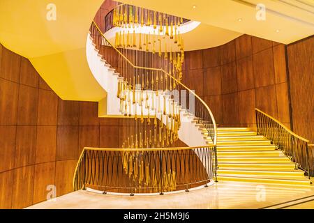 Dushanbe, Tajikistan. August 12, 2021. Decorative glass chandelier and spiral stairs. Stock Photo