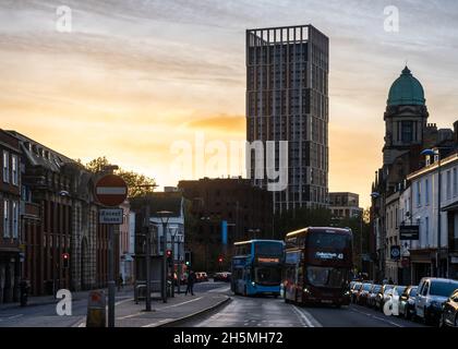 The sun sets behind Castle Park View and Old Market in Bristol, England. Stock Photo