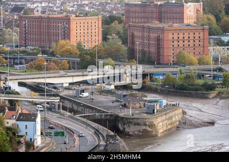 Traffic flows on the Plimsoll Bridge across the Floating Harbour entrance lock at Cumberland Basin in Bristol. Stock Photo