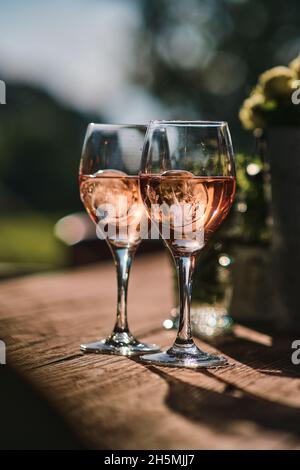 Two glasses of wine on wooden table. High quality photo Stock Photo