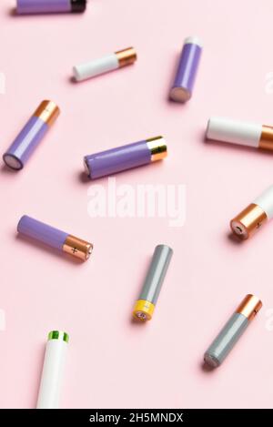 Alkaline batteries on pink background Stock Photo