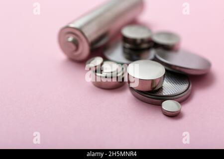 Different batteries on pink background, closeup Stock Photo