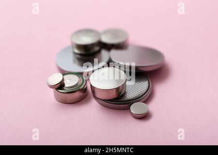 Lithium button cell batteries on pink background Stock Photo
