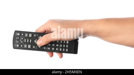 Woman pressing button on TV remote controller on white background, closeup Stock Photo