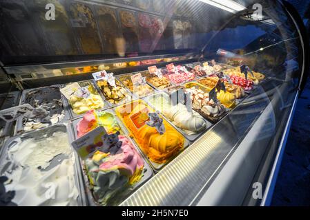 Perast,Montenegro-September 7th 2019: Various flavours and colors of Montenegrin ice cream,displayed in tubs to tempt passing tourists on a summer aft Stock Photo