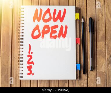 Conceptual caption Now Open. Internet Concept leave door or windows not closed or barred at this current time Blank Open Spiral Notebook With Diffrent Stock Photo
