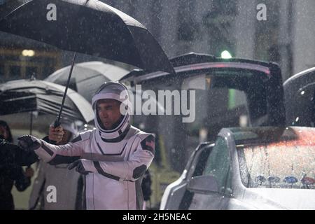 NASA astronaut Raja Chari, wearing a SpaceX spacesuit, points towards friends and family as he prepares to depart the Neil A. Armstrong Operations and Checkout Building for Launch Complex 39A to board the SpaceX Crew Dragon spacecraft for the Crew-3 mission launch, on Wednesday, November 10, 2021, at NASA's Kennedy Space Center in Florida. NASA's SpaceX Crew-3 mission is the third crew rotation mission of the SpaceX Crew Dragon spacecraft and Falcon 9 rocket to the International Space Station as part of the agency's Commercial Crew Program. Chari, NASA astronauts Tom Marshburn, Kayla Barron, Stock Photo