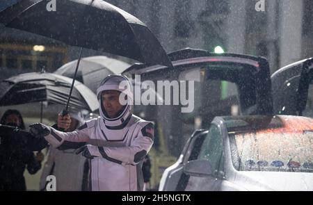 NASA astronaut Raja Chari, wearing a SpaceX spacesuit, points towards friends and family as he prepares to depart the Neil A. Armstrong Operations and Checkout Building for Launch Complex 39A to board the SpaceX Crew Dragon spacecraft for the Crew-3 mission launch, Wednesday, Nov. 10, 2021, at NASAs Kennedy Space Center in Florida. NASAs SpaceX Crew-3 mission is the third crew rotation mission of the SpaceX Crew Dragon spacecraft and Falcon 9 rocket to the International Space Station as part of the agencys Commercial Crew Program. Chari, NASA astronauts Tom Marshburn, Kayla Barron, and ESA Stock Photo