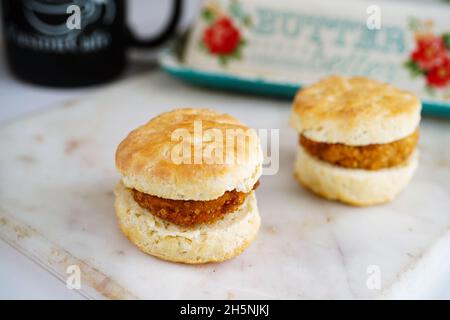 Chicken biscuit sandwich or sliders on white background, selective focus Stock Photo