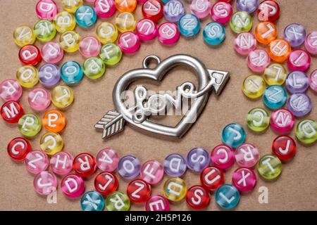 Heart shape and love wording amid colorful alphabet letters Stock Photo ...
