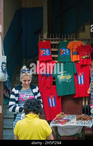 Havana, Cuba - January 20, 2016:  Vendor sells souvenirs, some featuring Che Guevara, in popular tourist spot in Havana. Stock Photo
