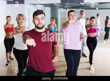 adults of different ages dancing at dance class Stock Photo