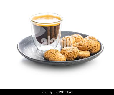 Amaretti biscuits. Sweet italian almond cookies and coffee cup isolated on white background. Stock Photo