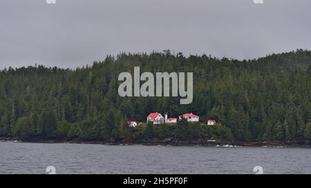 Remote lighthouse on addenbroke  island at the shore of Fitz Hugh Sound, Pacific Ocean, part of Inside Passage in British Columbia, Canada. Stock Photo