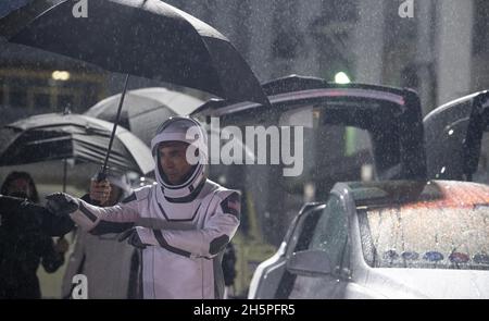 NASA astronaut Raja Chari, wearing a SpaceX spacesuit, points towards friends and family as he prepares to depart the Neil A. Armstrong Operations and Checkout Building for Launch Complex 39A to board the SpaceX Crew Dragon spacecraft for the Crew-3 mission launch, Wednesday, November 10, 2021, at NASA's Kennedy Space Center in Florida. NASA's SpaceX Crew-3 mission is the third crew rotation mission of the SpaceX Crew Dragon spacecraft and Falcon 9 rocket to the International Space Station as part of the agency's Commercial Crew Program. Chari, Marshburn, Barron, Maurer are scheduled to launch Stock Photo