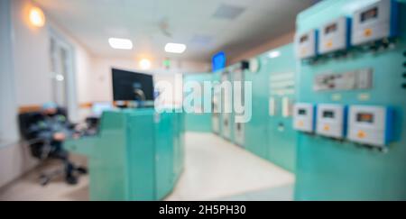 Blurred industrial background, Engineering panel with buttons and switching automatic control of nuclear power plant. Stock Photo