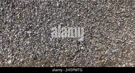panorama view from above on surface of small pebbles on the sea coast Stock Photo