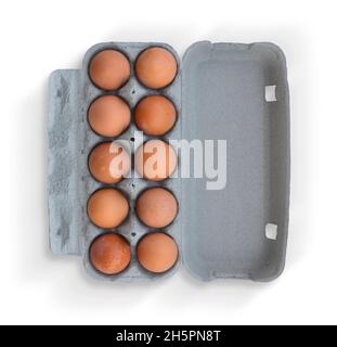 Ten brown eggs on cardboard box isolated on white background Stock Photo