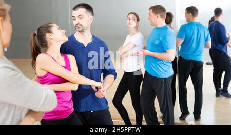 Young couple practicing active dance in pair Stock Photo