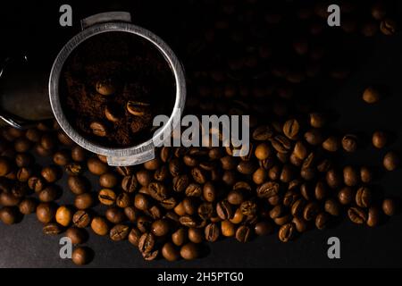 Coffee beans in the coffee horn on the background of coffee beans Stock Photo