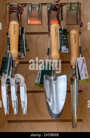 selection of gardeners hand tools including spade and fork for digging borders and gardens, hand tools for gardening, gardeners tools, garden centre. Stock Photo
