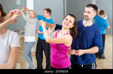 Young couple practicing active dance in pair Stock Photo