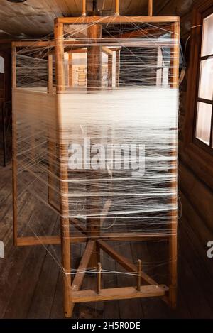 Thin woven threads wrapped on wooden frames of weaver loom Stock Photo