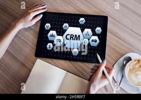 CRM - customer relationship management system concept on screen. Stock Photo