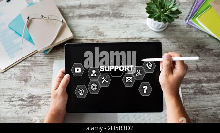 Technical support icons on screen. Call to help center. Internet and technology concept. Stock Photo