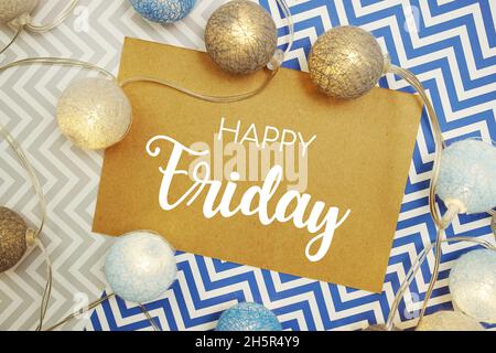 Happy Friday typography text on paper card with LED cotton balls decoration Stock Photo