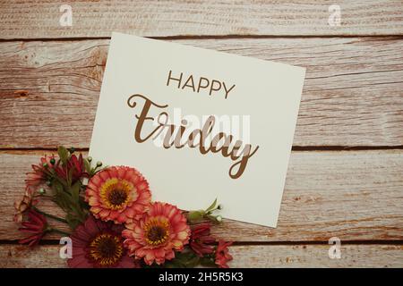 Happy Friday card typography text with flower bouquet on wooden background Stock Photo