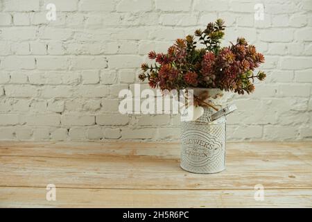 green artificial plant with space copy on white brick wall background Stock Photo